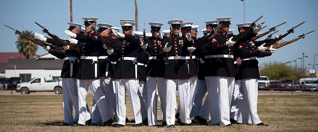 The Marine Corps Silent Drill Platoon executes its "bursting bomb" formation during a Battle Color Detachment ceremony at Marine Corps Air Station Yuma, Ariz., March 1, 2012. The BCD, composed by SDP, the U.S. Marine Drum and Bugle Corps and Marine Corps Color Guard, is currently on its National Installations Tour.