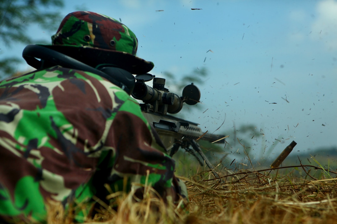 ANTRA LINA TRAINING AREA, Indonesia-An Indonesian Marine fires an M-82 Special Application Scoped Rifle during sniper training with U.S. Marines of Landing Force Company May 29. During the sniper training, U.S. and Indonesian Marines learned to operate the weapon systems of one another. Landing Force Company is participating in Cooperation Afloat Readiness and Training (CARAT) 2011. CARAT is an annual series of bilateral exercises held between the U.S. and Southeast Asian nations with the goals of enhancing regional cooperation, promoting mutual trust and understanding, and increasing operational readiness. While in Indonesia, the service members from both nations train together on martial arts, military operations on urban terrain, jungle warfare, combat marksmanship and combat lifesaving.