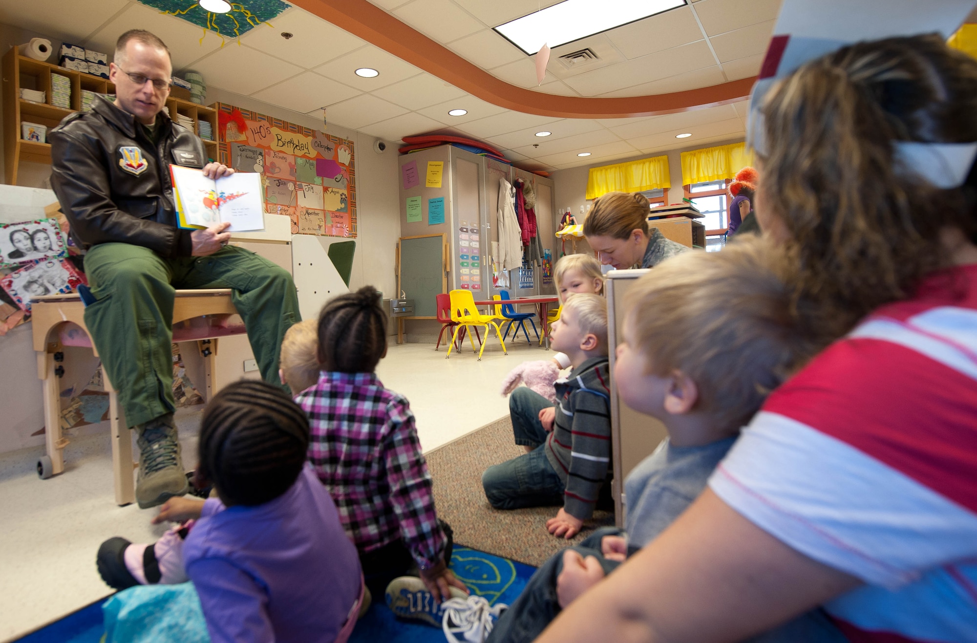 Col. Mark Weatherington, 28th Bomb Wing commander, reads “Go Dog Go” to a group of 2-year-olds at the Child Development Center at Ellsworth Air Force Base, S.D., March 2, 2012. Weatherington encourages all Airmen to volunteer and participate in community events and activities whenever possible. (U.S. Air Force photo by Airman 1st Class Zachary Hada/Released)