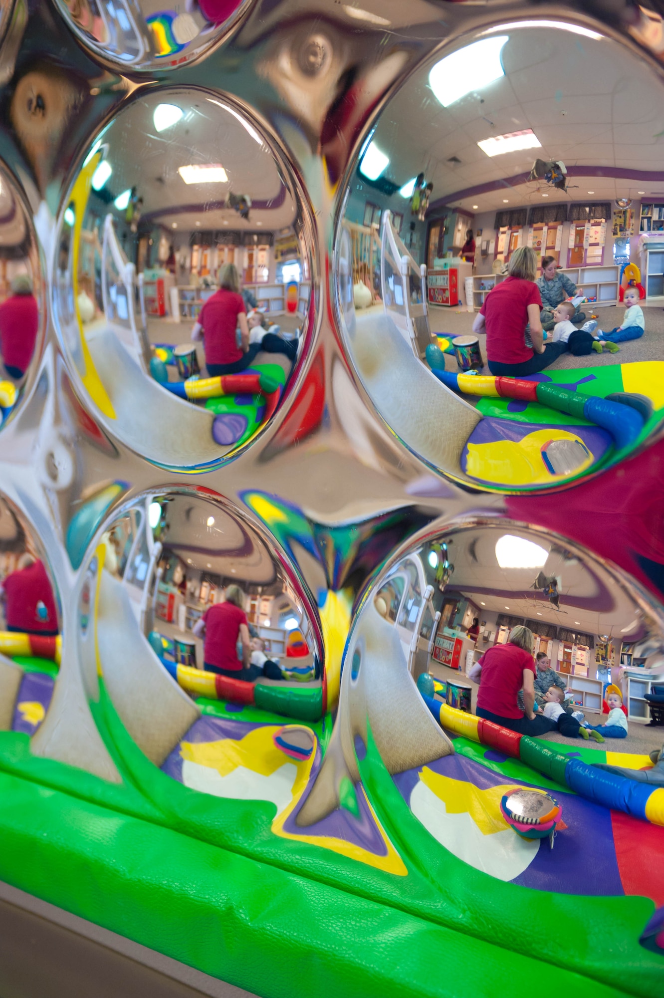 Airman 1st Class Leslie Hibbitts, 28th Contracting Squadron contract administrator, reads Dr. Seuss stories to a group of children at the Child Development Center at Ellsworth Air Force Base, S.D., March 2, 2012. Ellsworth Airman participated in Read Across America, a national program honoring the birthday of Dr. Seuss by reading his books to children. (U.S. Air Force photo by Airman 1st Class Zachary Hada/Released)