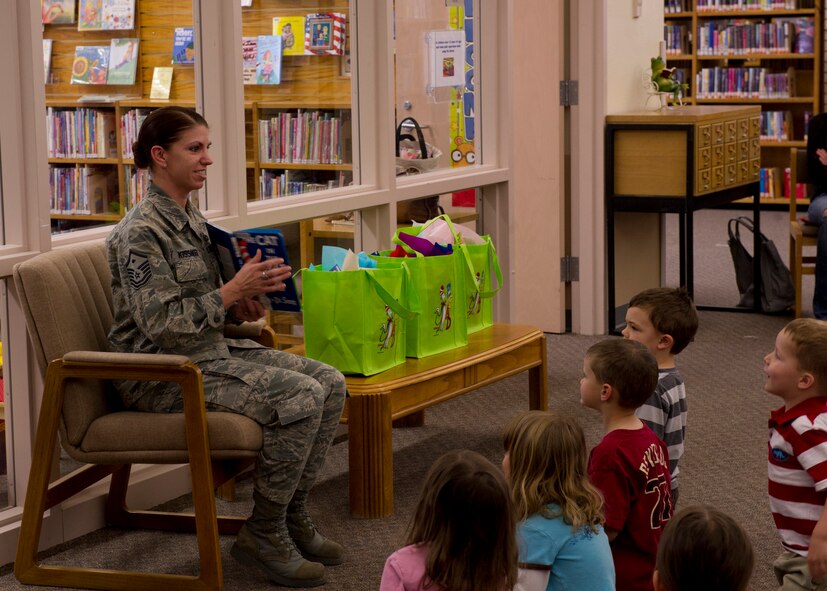 HOLLOMAN AIR FORCE BASE, N.M. – Master Sgt. Tamara Kissinger, 49th Operations Support Squadron first sergeant, reads “The Cat in the Hat” March 2 at the base library for the birthday celebration of Theodor Geisel, who is more commonly known as “Dr. Seuss.” “The Cat in the Hat,” which was published in 1957, has been made into several television adaptations and a film adaptation that was released in 2003. Kissinger was one of three first sergeants who read different Dr. Seuss books to more than 40 children of Team Holloman. (U.S. Air Force photo by Airman 1st Class Siuta B. Ika/Released)