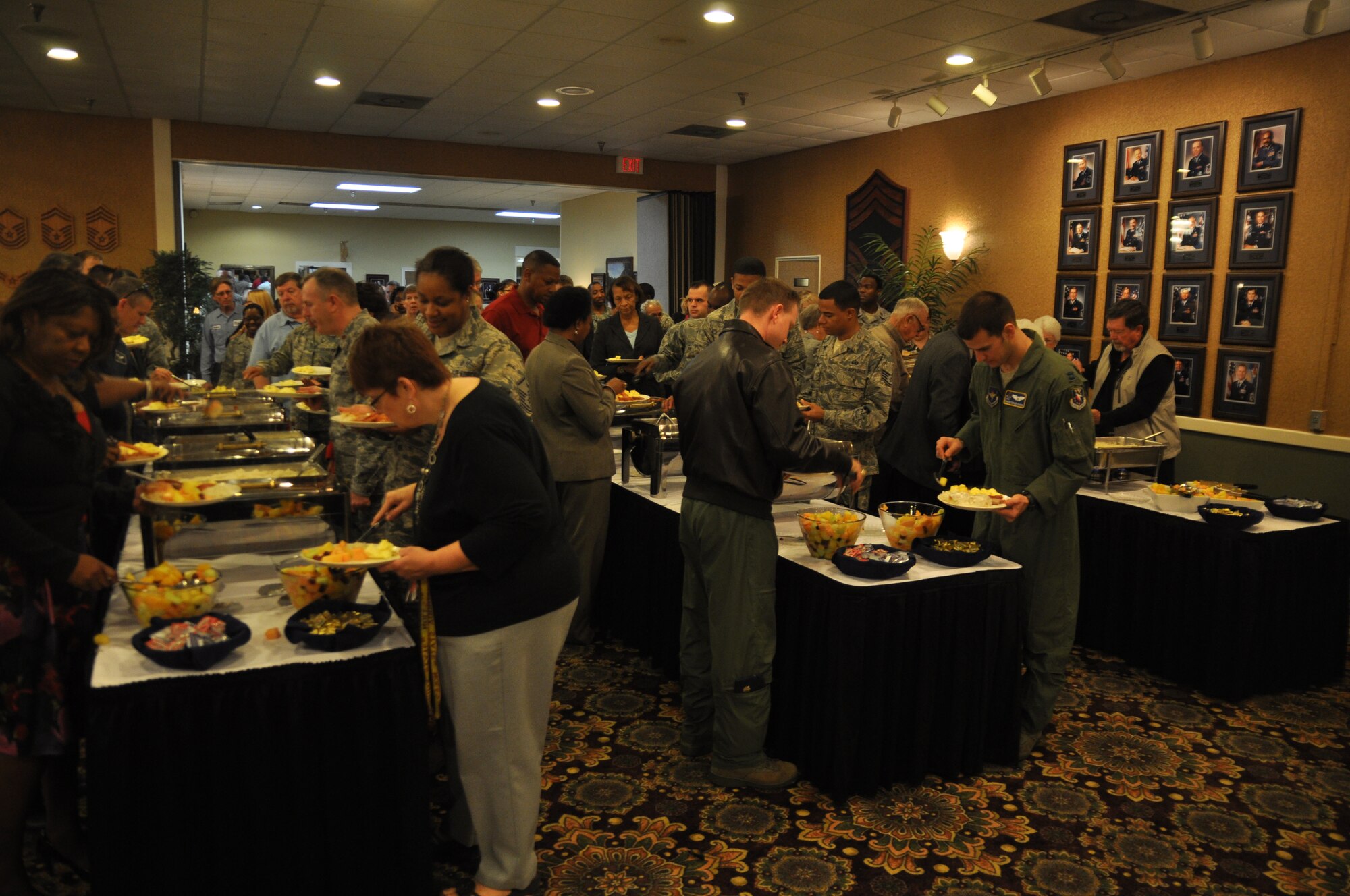 Airmen and community members enjoy a meal during the National Prayer Breakfast Feb. 28 at the Columbus Club on Columbus Air Force Base.  Atendees were able to choose from eggs, sausage, bacon, biscuits and gravy and grits. (U.S. Air Force Photo/Airman 1st Class Charles Dickens)
