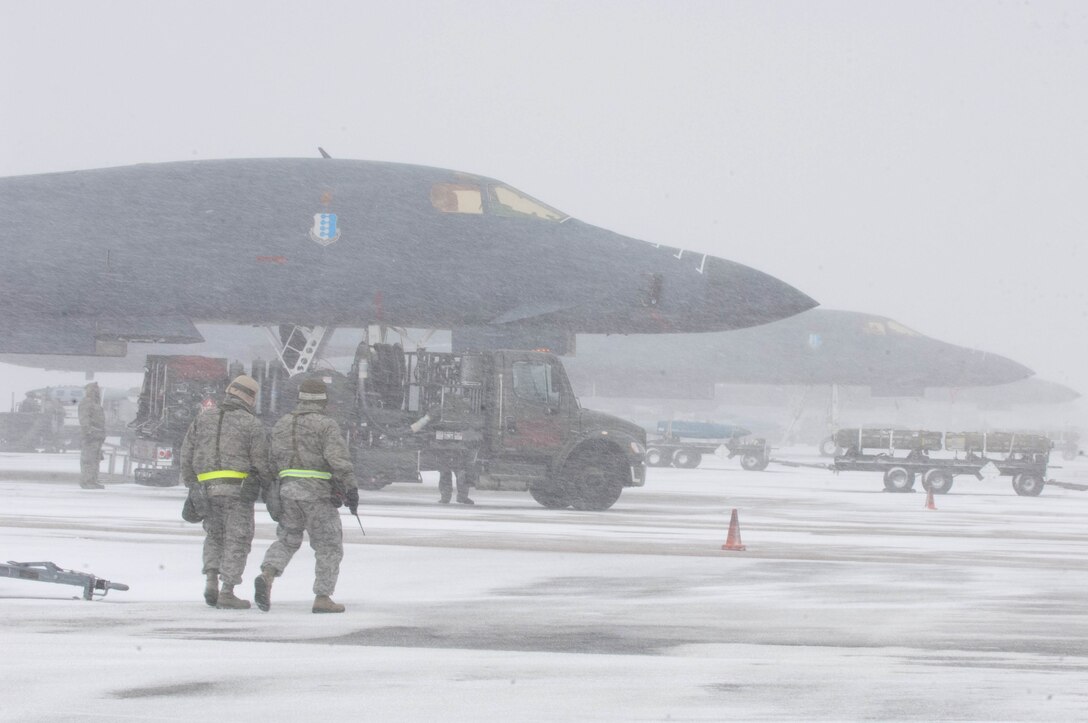 Airmen assigned to the 28th Aircraft Maintenance Squadron prepare B-1 bombers for flight during the Operational Readiness Exercise at Ellsworth Air Force Base, S.D., Feb. 24, 2012. The ORE tested how effectively and efficiently Ellsworth is able to mobilize and process personnel and assets during wartime contingencies. (U.S. Air Force photo by Airman 1st Class Zachary Hada/Released)