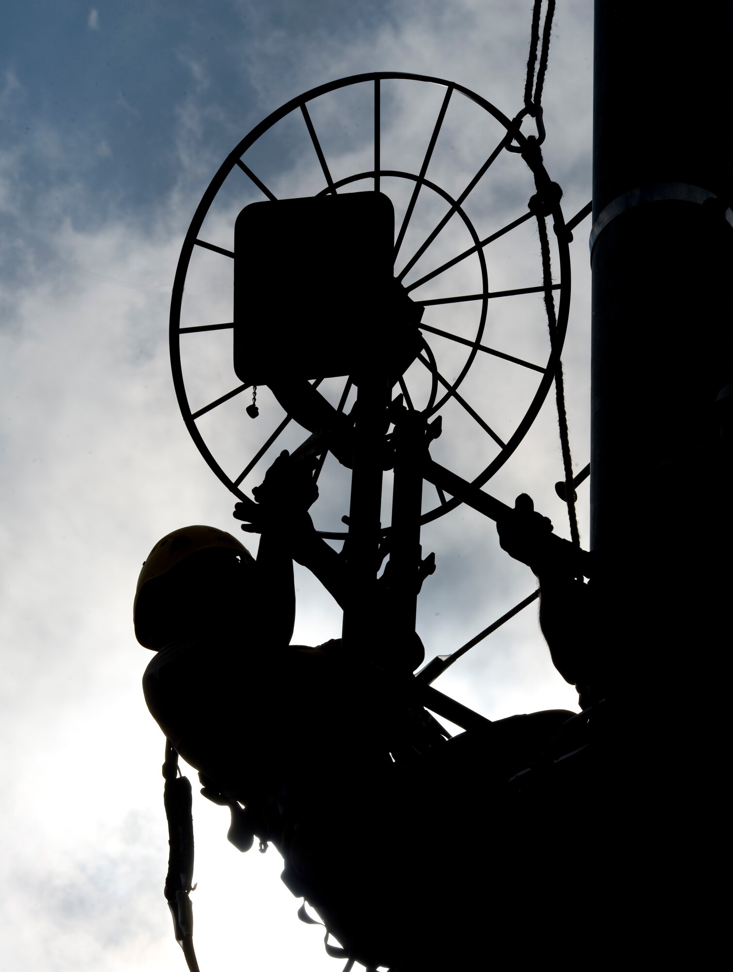Airmen from 2nd Communications Squadron cable and antenna maintenance attach an Aircraft Alerting Communications Electromagnetic pulse antenna on the bottom portion of the tower in front of the 2nd Civil Engineer Squadron building on Barksdale Air Force Base, La., Feb. 28. The AACE antenna sends out emergency messages to aircraft in the event that other communication devices are disabled. (U.S. Air Force photo/Airman 1st Class Benjamin Gonsier)(RELEASED)