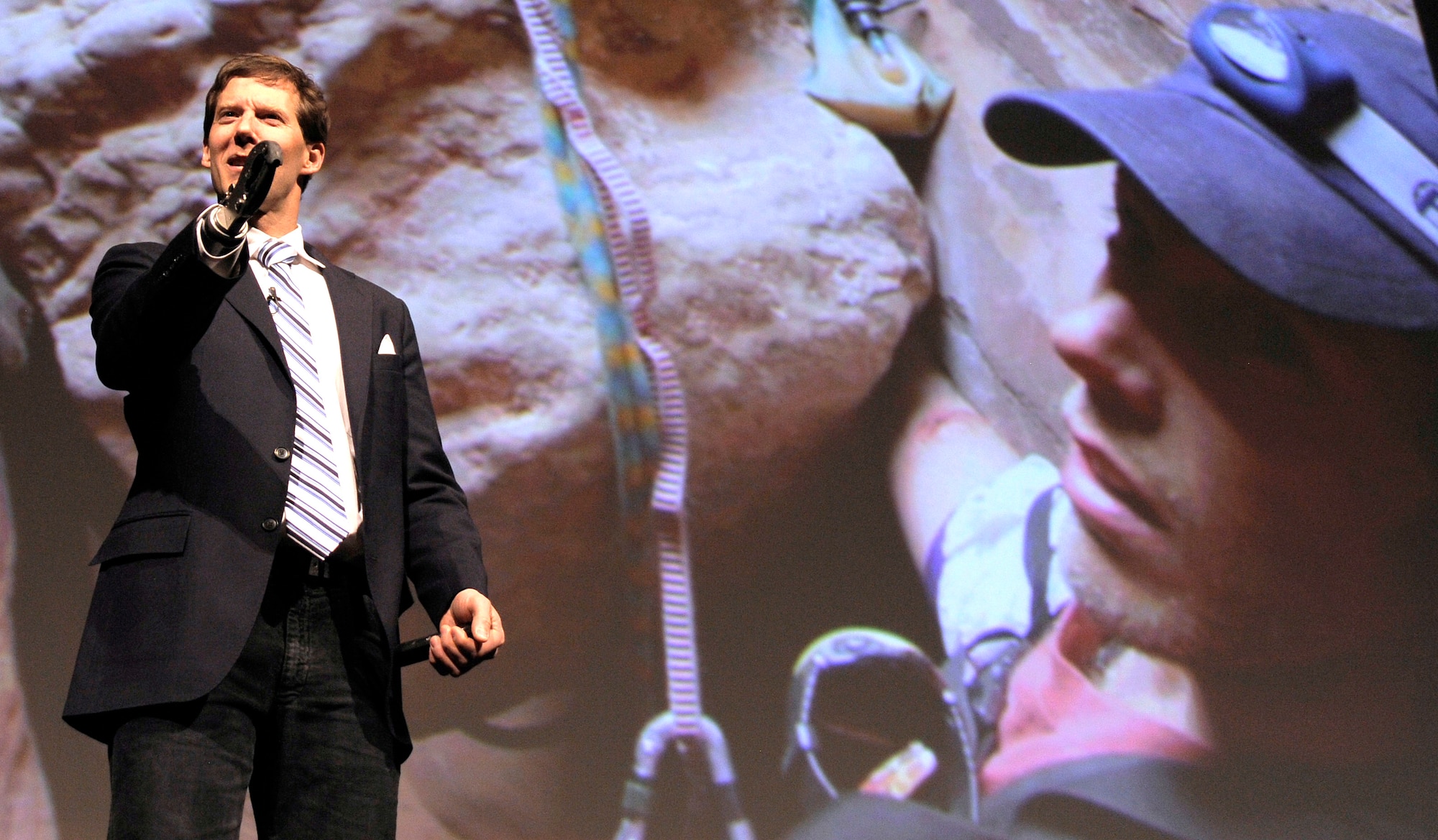 Aron Ralston speaks to an audience in the Air Force Academy's Arnold Hall Theater during the National Character and Leadership Symposium Feb. 24, 2012. Ralston, the subject of the film "127 Hours," amputated his own right arm to save his life after a mountain-climbing accident in Utah in 2003. (U.S. Air Force photo/Mike Kaplan)