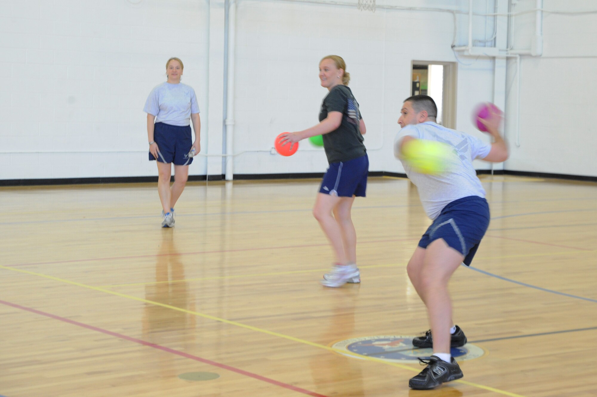 Capt. John Bixby and Angela Montgomery, Air Force District of Washington
installations and mission support, tag out their opponents in Dodge ball
March 1 at the West Fitness Center, Joint Base Andrews, Md., in the blind
free throw competition. The February Fitness Challenge capstone event
featured a relay race, medicine ball toss, blind free throws, a three-legged
race and Dodge ball. (U.S. Air Force photo by Airman 1st Class Tabitha N.
Haynes)
