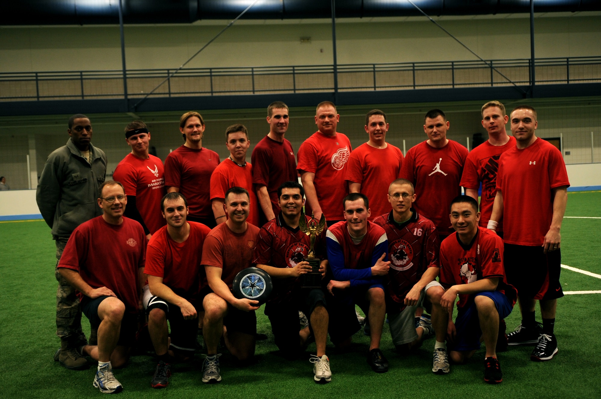 The 319th Civil Engineer Squadron poses for a group photo after the Grand Forks Air Force Base, N.D.,  Ultimate Frisbee Championship game on  March 1, 2012. The squadron came out on top with their 5th consecutive championship game win. (U.S. Air Force photo by Staff Sgt. Amanda N. Grabiec)
