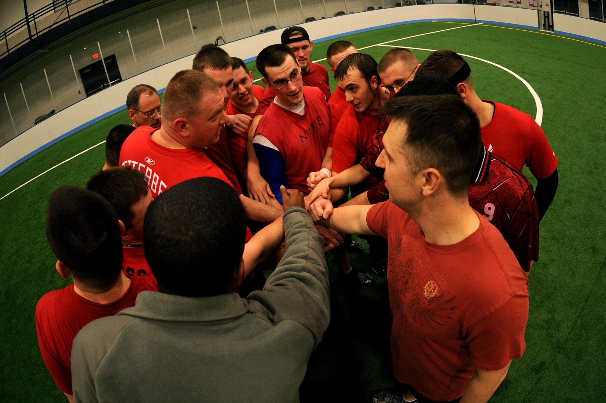 The 319th Civil Engineer Squadron huddles before the second half of the Grand Forks Air Force Base, N.D., Ultimate Frisbee Championship game at the Field House on March 1, 2012. The 319th Civil Engineer Squadron came out on top with their 5th consecutive championship game win. (U.S. Air Force photo by Staff Sgt. Amanda N. Grabiec)