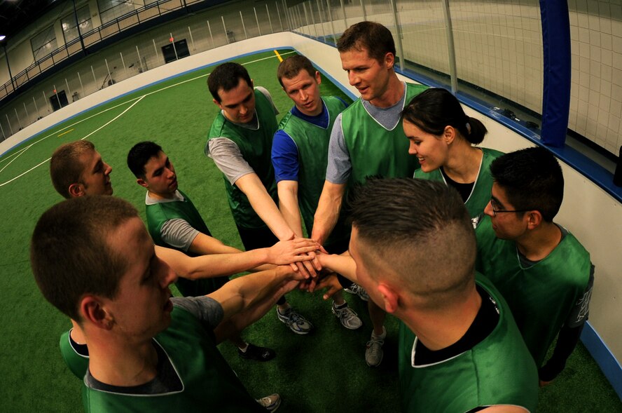 The 319th Medical Group huddles before the second half of the Grand Forks Air Force Base, N.D., Ultimate Frisbee Championship game at the Field House on March 1, 2012. The 319th Civil Engineer Squadron came out on top with their 5th consecutive championship game. (U.S. Air Force photo by Staff Sgt. Amanda N. Grabiec)