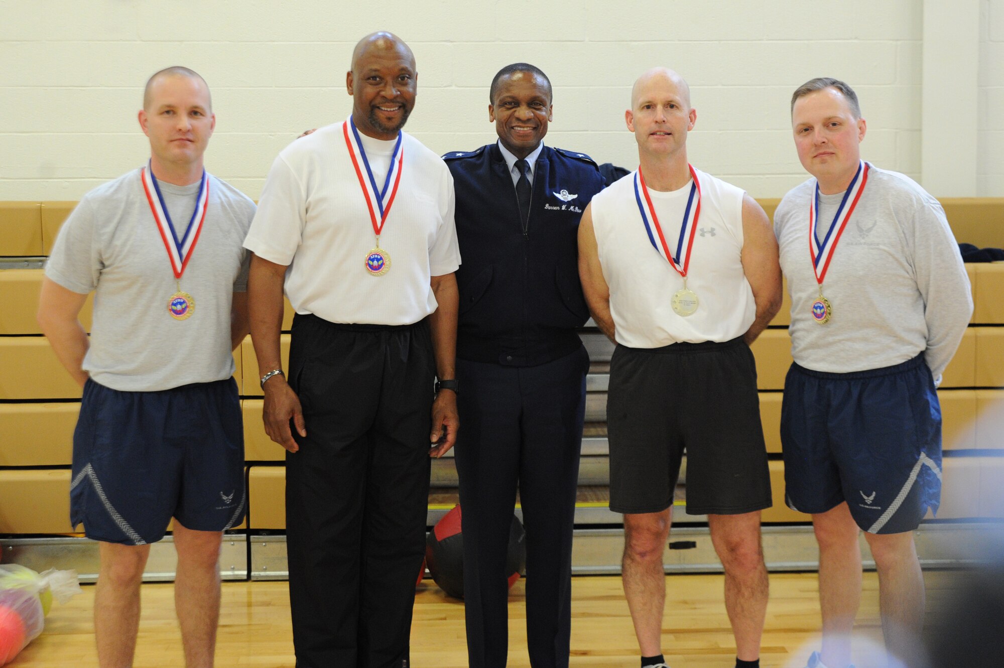 Air Force District of Washington Commander Maj. Gen. Darren W. McDew
congratulates Team Doom March 1 at the West Fitness Center, Joint Base
Andrews, Md. The team won the weight lifting category in the February
Fitness Challenge, lifting more than 3,060,230 pounds. (U.S. Air Force photo
by Airman 1st Class Tabitha N. Haynes)
