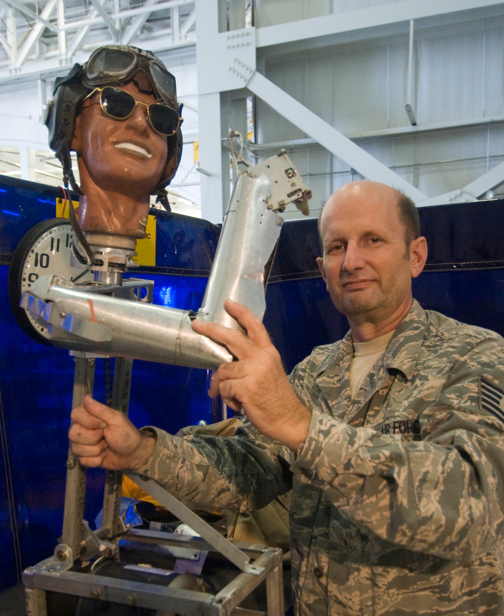 Tech. Sgt. Daniel Glessner, 459thMaintenance Squadron machinist, shows skeletal structure of motorized mannequin, named after his son, Brian during some recent upgrades.  (Photo/Bobby Jones)