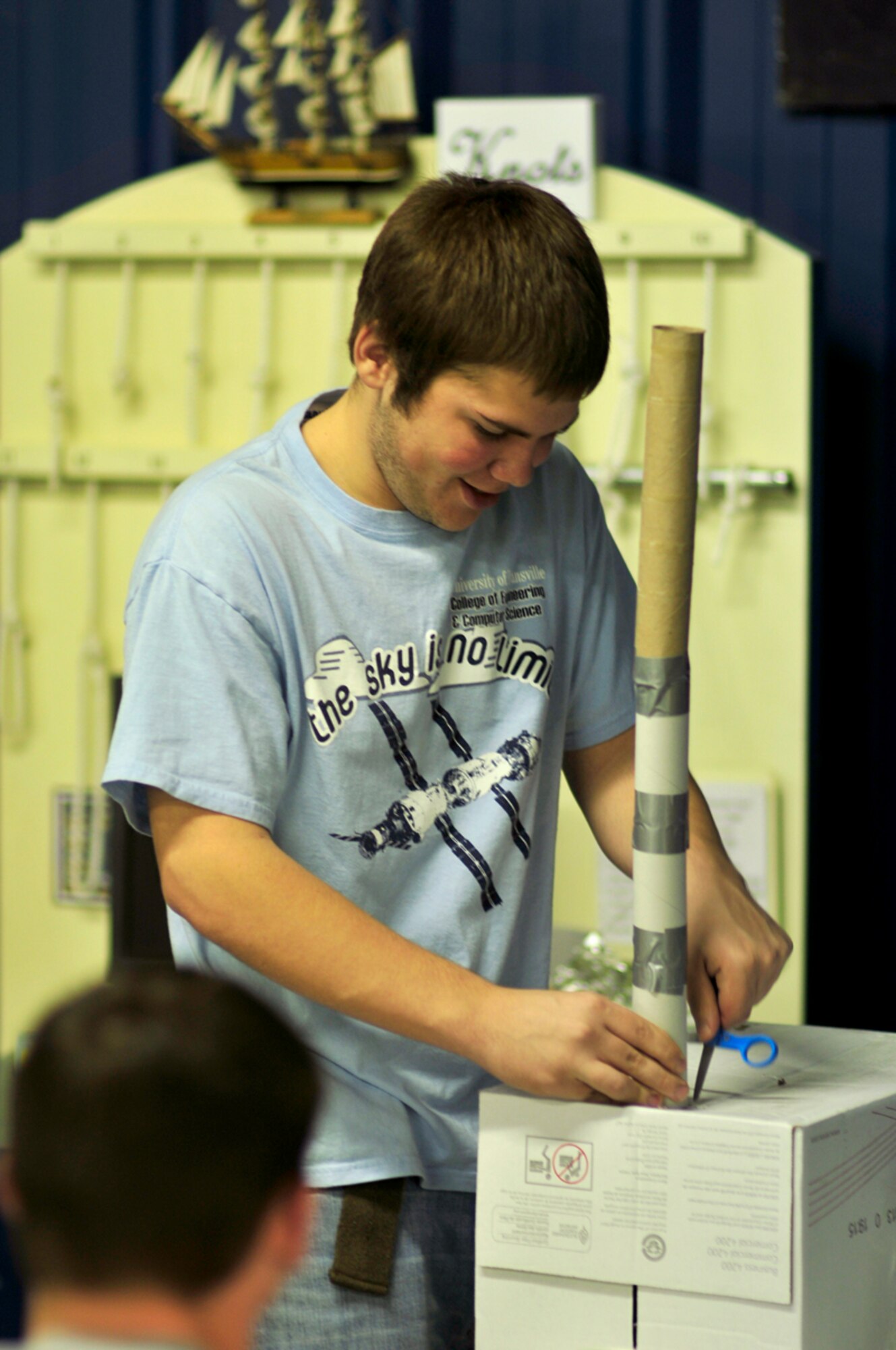 Moore County High School junior Dakota Bateman works on a space elevator designed to carry a payload a minimum distance of half a meter during the Student Design Competition held at the Hands-On Science Center Feb. 21. (Photo by Jacqueline Cowan)