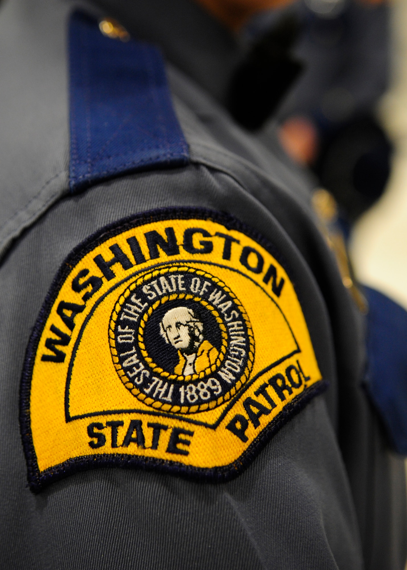 Hundreds of law enforcement personnel from the surrounding community gathered March 1, 2012, at Joint Base Lewis-McChord, Wash., joining a procession to a memorial service for fallen Washington State Patrol Trooper Tony Radulescu, killed in the line of duty. Personnel came from as far away as Montana and Canada to show their support. (U.S. Air Force photo/Airman 1st Class Leah Young)