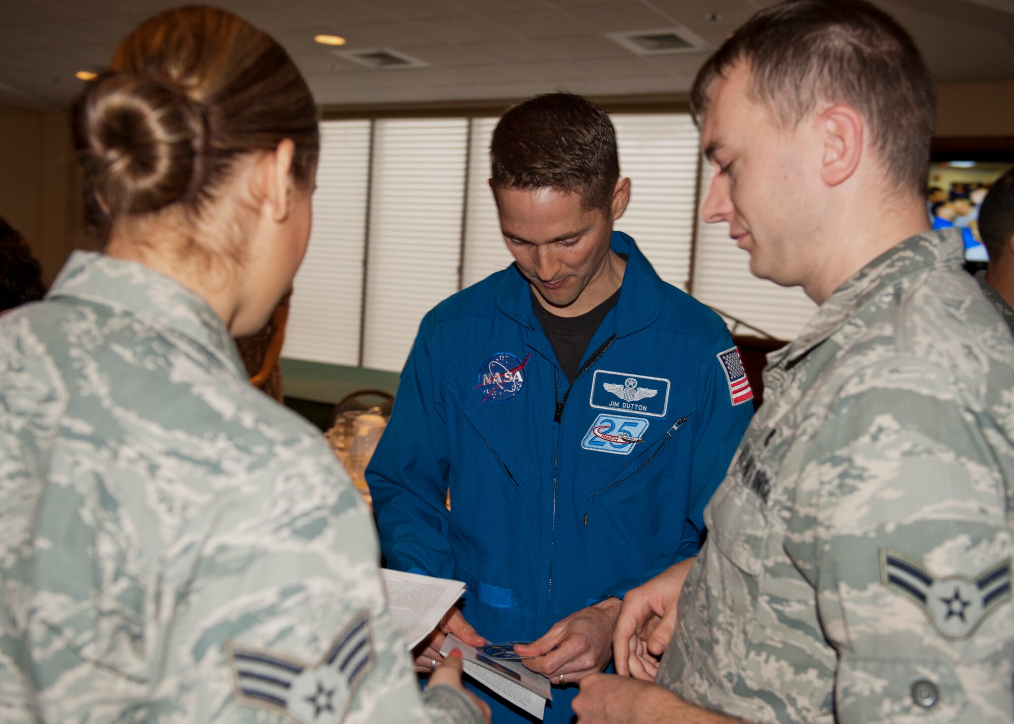 Col. James Dutton, a NASA astronaut, talks with Airmen after his speech at the National Prayer Breakfast at Eglin Air Force Base, Fla., March 1. (U.S. Air Force photo/Chrissy Cuttita)