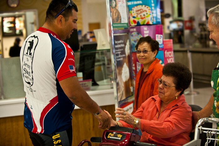 Wesley Leon-Barrientos shares a moment with Mary Tenorio, spouse of veteran Diego Tenorio, inside the Base Exchange March 1, 2012, at Nellis Air Force Base, Nev. Barrientos lost both of his legs while serving in Iraq as a U.S. Army infantryman. Leon-Barrientos and Staat embarked on this endeavor to raise awareness about veteran issues and build unity among American veterans. (U.S. Air Force photo by Senior Airman Brett Clashman)