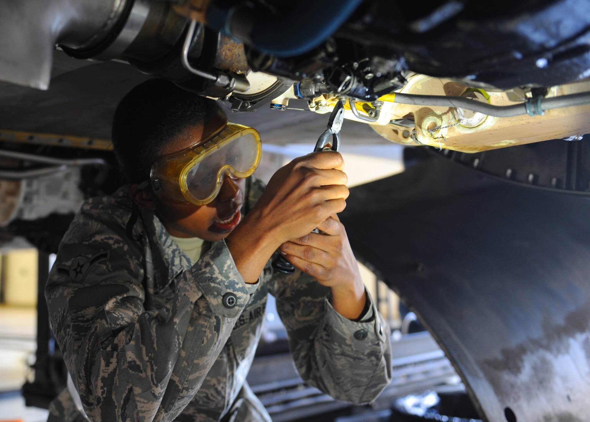 U.S. Air Force Airmen Muriel Seabrooks, Detachment 20, works on a B-1 Bomber during crew chief training March 1, 2012, at Dyess Air Force Base, Texas. The Airmen are working to complete technical training to achieve a journeyman skill level in their career field. (U.S. Air Force photo by Airman 1st Class Cierra Bullock/Released) 