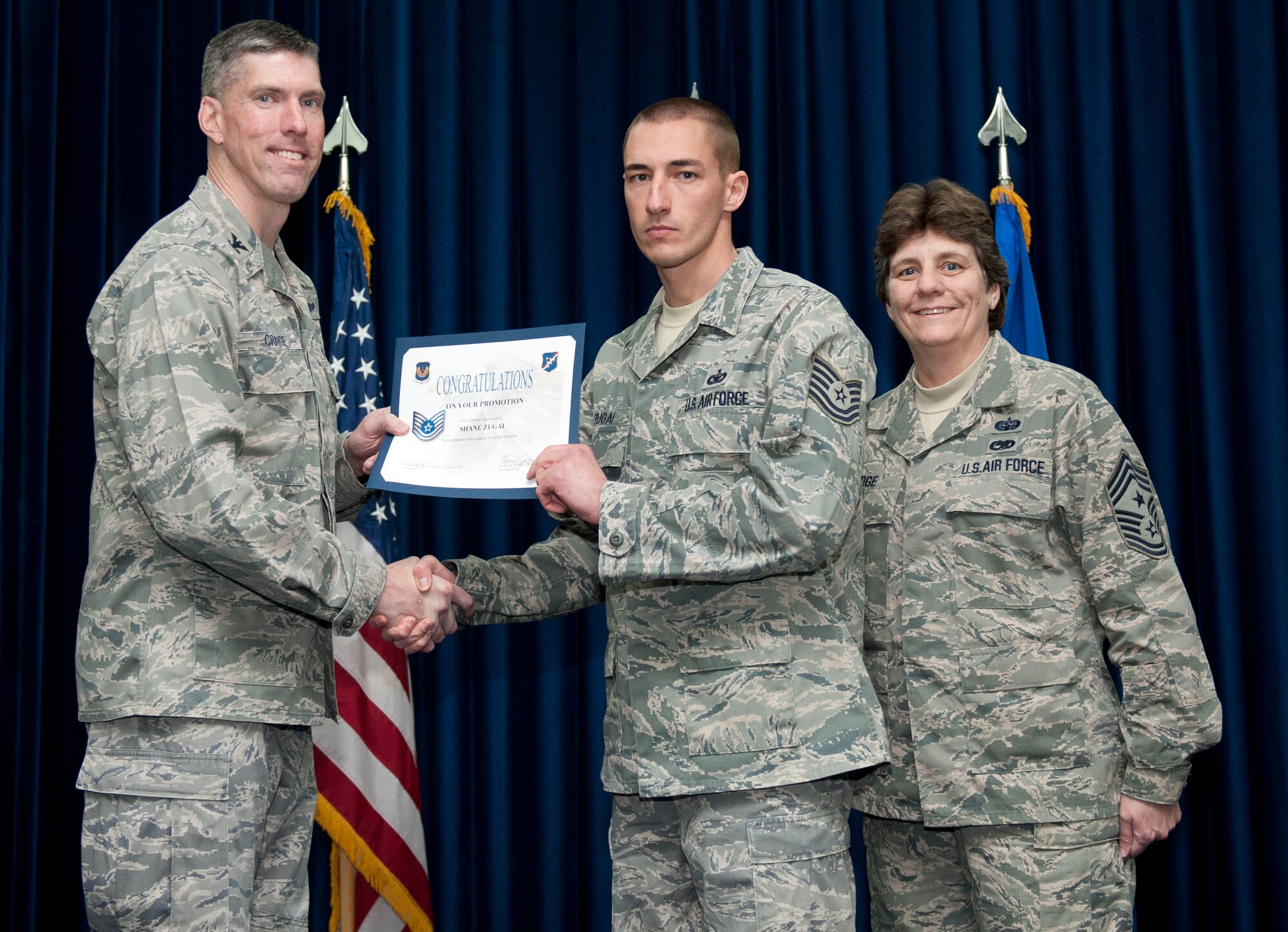 Shane Zugai, 39th Security Forces Squadron, is promoted to the rank of technical sergeant Feb. 29, 2012, at the Club Complex ballroom at Incirlik Air Base, Turkey. (U.S. Air Force photo by Senior Airman Clayton Lenhardt/Released)