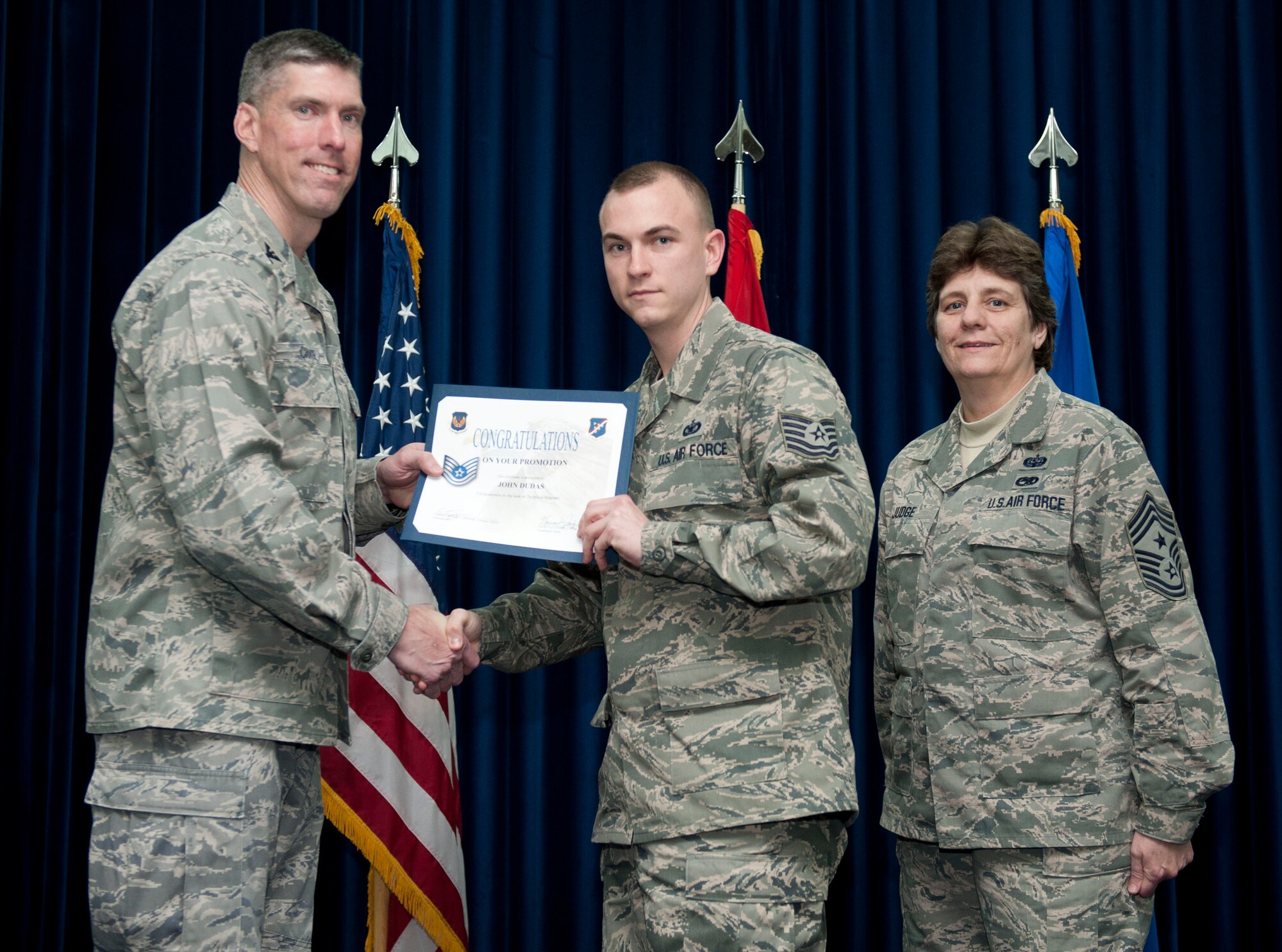 John Dudas, 39th Security Forces Squadron, is promoted to the rank of technical sergeant Feb. 29, 2012, at the Club Complex ballroom at Incirlik Air Base, Turkey. (U.S. Air Force photo by Senior Airman Clayton Lenhardt/Released)