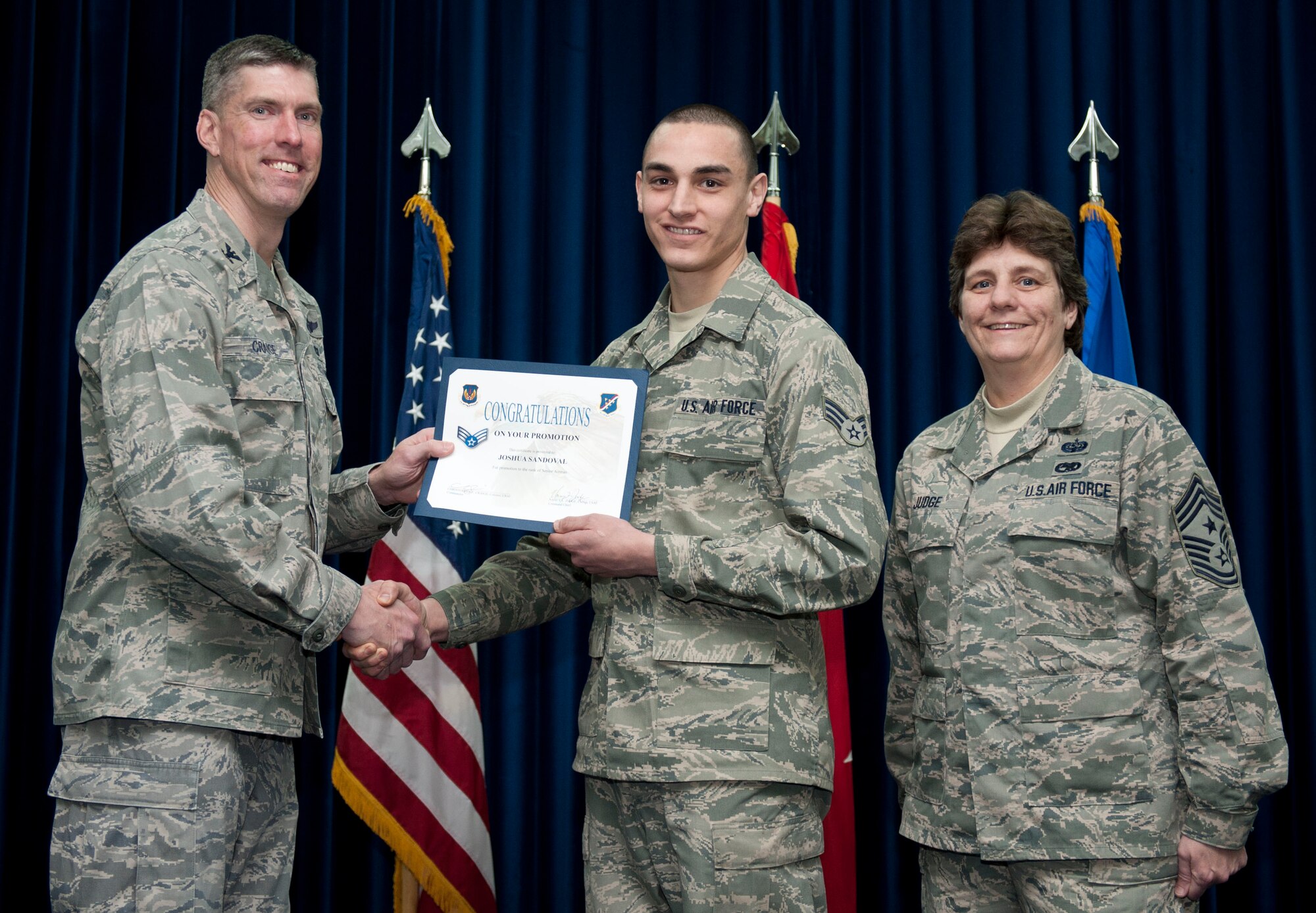 Joshua Sandoval, 728th Air Mobility Squadron, is promoted to the rank of senior airman Feb. 29, 2012, at the Club Complex ballroom at Incirlik Air Base, Turkey. (U.S. Air Force photo by Senior Airman Clayton Lenhardt/Released)