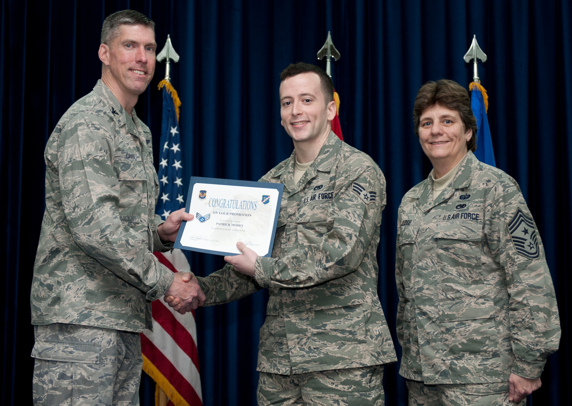 Patrick Morey, 728th Air Mobility Squadron, is promoted to the rank of senior airman Feb. 29, 2012, at the Club Complex ballroom at Incirlik Air Base, Turkey. (U.S. Air Force photo by Senior Airman Clayton Lenhardt/Released)