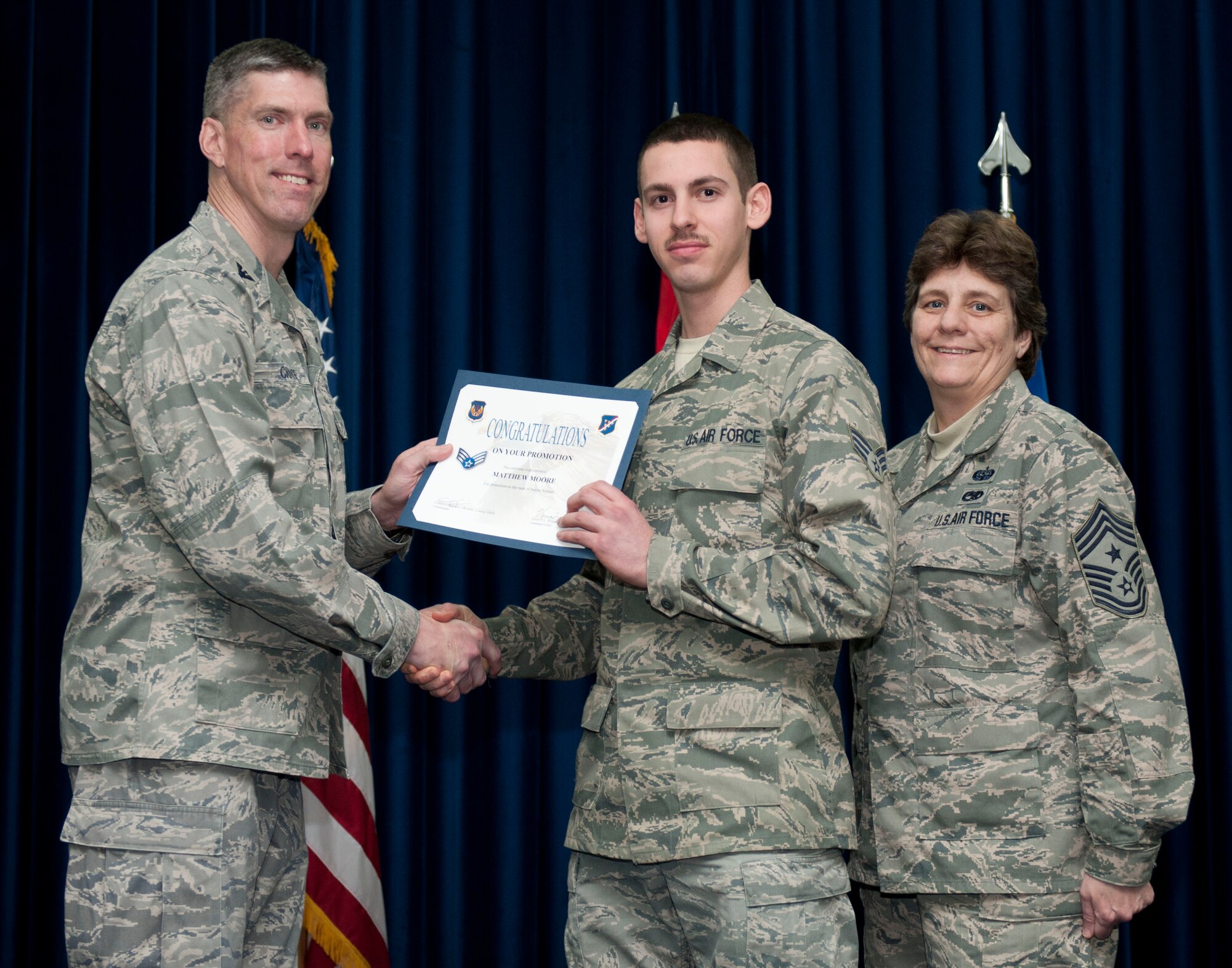 Matthew Moore, 39th Logistics Readiness Squadron, is promoted to the rank of senior airman Feb. 29, 2012, at the Club Complex ballroom at Incirlik Air Base, Turkey. (U.S. Air Force photo by Senior Airman Clayton Lenhardt/Released)