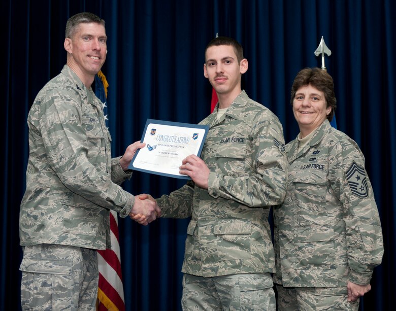 Matthew Moore, 39th Logistics Readiness Squadron, is promoted to the rank of senior airman Feb. 29, 2012, at the Club Complex ballroom at Incirlik Air Base, Turkey. (U.S. Air Force photo by Senior Airman Clayton Lenhardt/Released)