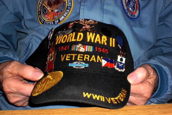 A cap covered in commemorative patches and pins is displayed by retired U.S. Army 1st Sgt. Evert “Sarge” Carter Feb. 8, 2012, at the Seattle-Tacoma International Airport. Sarge is a veteran of World War II, the Korean War, the Vietnam War and the Cold War, and has accumulated 11,500 hours volunteering at the USO, Veterans Administration hospital and Tahoma National Cemetery. (U.S. Air Force photo by Senior Airman Brigitte N. Brantley/Released)