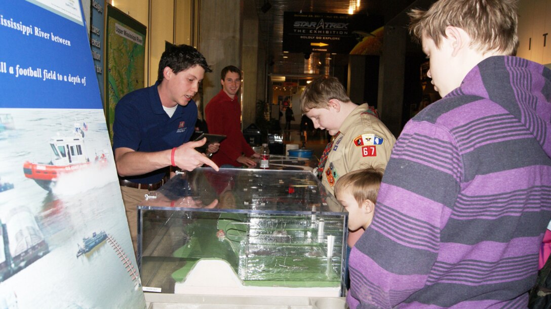 ST. LOUIS, Mo. — U.S. Army Corps of Engineers' Jose Lopez explains the science behind building a levee to children Feb. 25 during Engineer Week at the St. Louis Science Center.