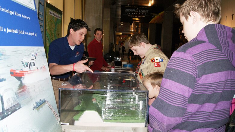 ST. LOUIS, Mo. — U.S. Army Corps of Engineers' Jose Lopez explains the science behind building a levee to children Feb. 25 during Engineer Week at the St. Louis Science Center.