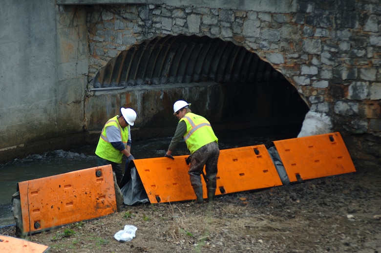 MARYVILLE, Tenn. — A work crew installs an aqua levee system Feb. 29, 2012 that will act as a makeshift coffer dam to collect and pump our water from Brown Creek and discharge it downstream past Greenbelt Lake.  Once the lake is dry the U.S. Army Corps of Engineers Nashville District will remove sediment as part of an aquatic ecosystem restoration project. 