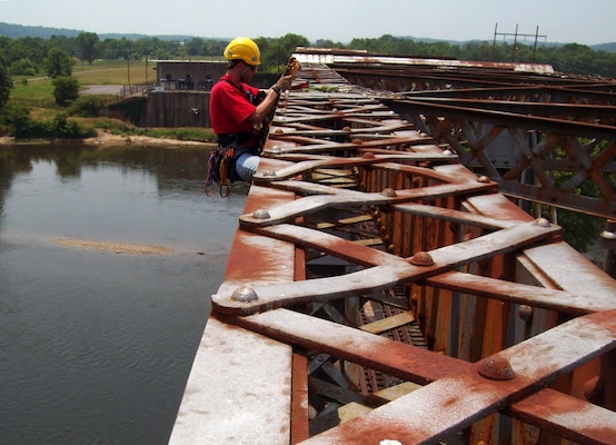 TENNESSEE — Steve Hobbs, structural engineer for the U.S. Army Corps of Engineers St. Louis District and Level I certified for rope access technician, prepares to inspect the top chords of the railroad truss at the Holston Army Ammunition Plant in Tennessee. The St. Louis District employs this unique technique to conduct inspections of bridges, dams and other structures in the Corps of Engineers and other federal agencies.