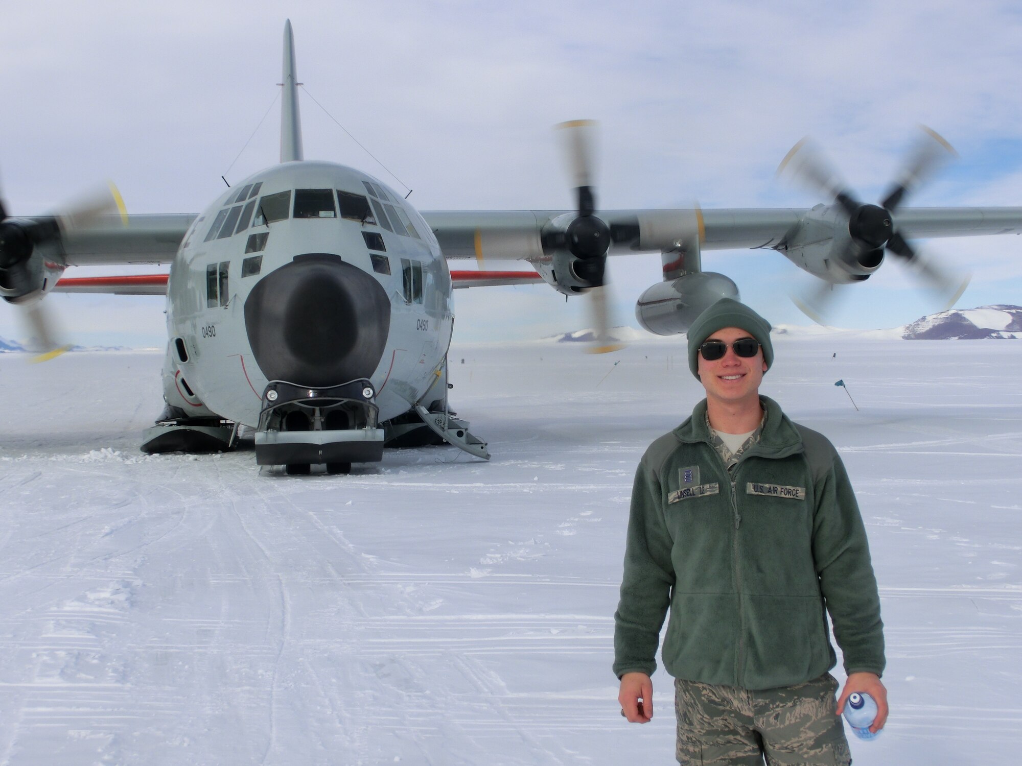 U.S. Air Force Academy Cadet 1st Class Joshua Linsell, meteorology major, stands in front of an LC-130 during one his flights in the Antarctic. Linsell visited in December as part of a joint U.S. Antarctic Program and Air Force’s Nation Science Foundation trip. (Courtesy photo)