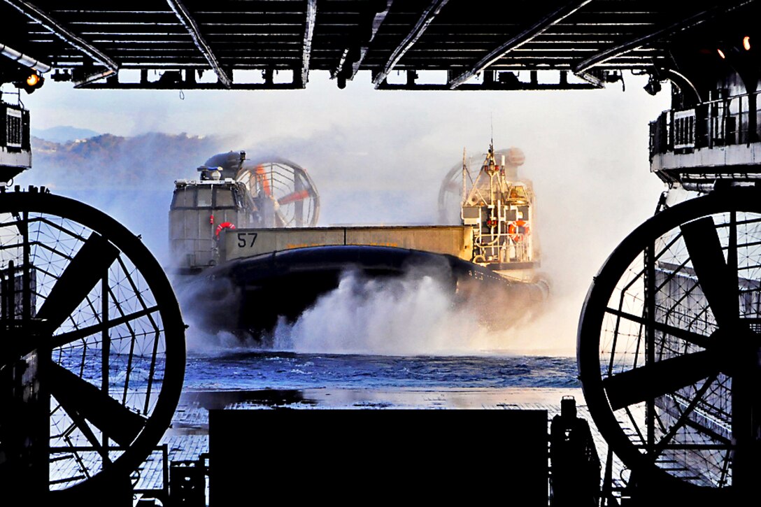 A landing craft vehicle enters the well deck of the forward-deployed amphibious assault ship USS Essex in Sasebo, Japan, Feb. 27, 2012. The Essex is the lead ship of the only forward-deployed amphibious ready group.
