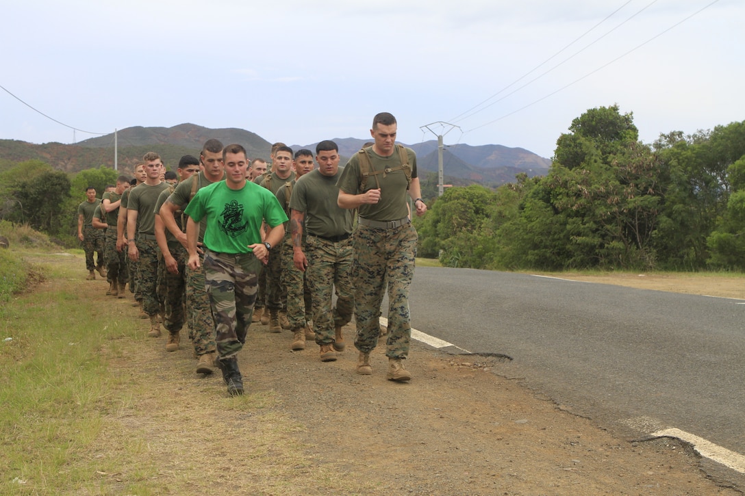 PLUM BASE, New Caledonia-U.S. Marines and sailors with 2nd Battalion, 3rd Marine Regiment and a French armed forces Marine conduct physical training on French armed forces, New Caledonia's Plum Base, New Caledonia, France, during Exercise AMERICAL 2011, Sept. 21, 2011. Exercise AMERICAL 2011 is a platoon-level combat arms combined exchange between the French armed forces, New Caledonia and U.S. Marines with the purpose of maintaining a high level of interoperability, enhancing military-to-military relations and improving mutual combat capabilities with French allies.