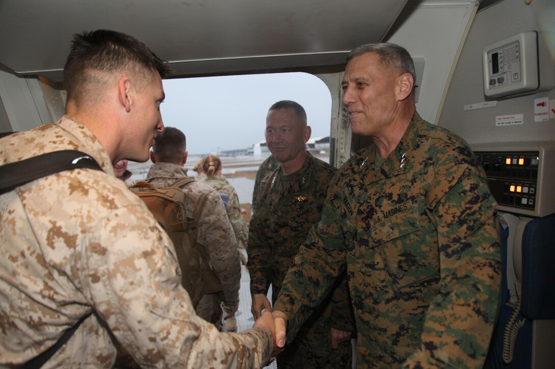 Lt. Gen. John M. Paxton , Jr., and Maj. Gen. Jon M. Davis greet Marines off the plane delivering the 2nd Marine Aircraft Wing (Forward) to MCAS Cherry Point after their combat deployment to Afghanistan March 3. The wing deployed Feb. 9, 2011 and conducted air support missions for the 2nd Marine Expeditionary Force in southern Afghanistan.