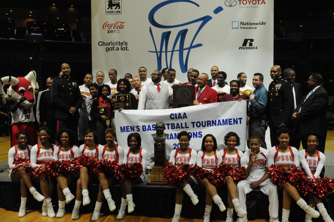 Colonel Grover C. Lewis III, assistant chief of staff/ director of the department of public safety, Marine Corps Installations East and Capt. Robert Brooks, officer selection officer for Gainesville, Fla., pose with the Winston-Salem State University Men's Basketball team, the winners of the 2012 Central Intercollegiate Athletic Conference (CIAA)  basketball tournament, Charlotte, N.C., March 3, 2012. The CIAA tournament is the nation’s longest running historically black basketball tournament. (U.S. Marine Corps photo by Sgt. Michael V. Walters) (Released)