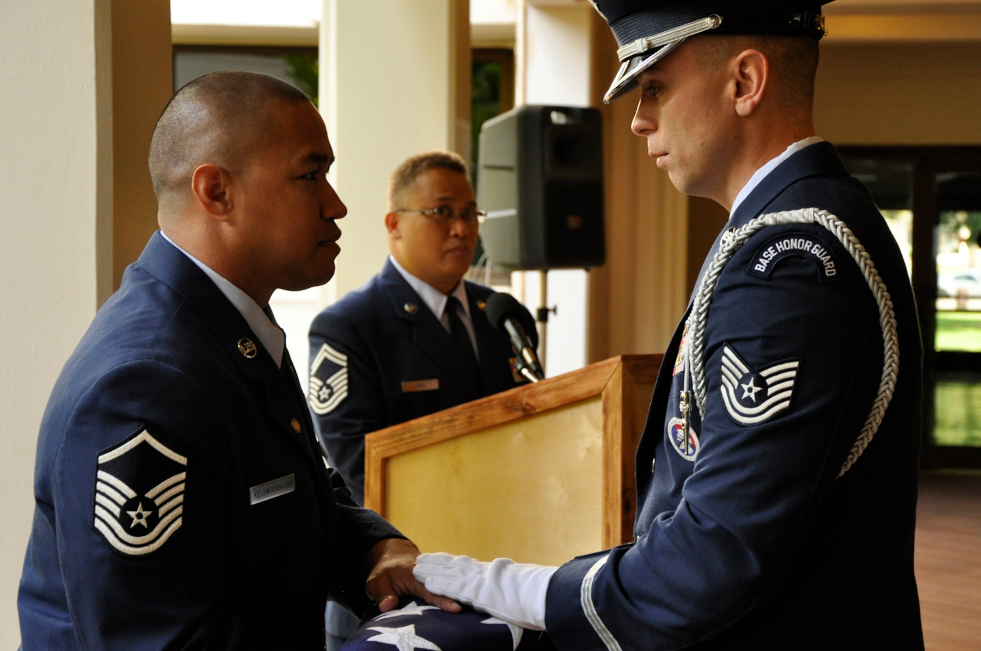JOINT BASE PEARL HARBOR-HICKAM, Hawaii -- Master Sgt. Homer Keliiwaiwaiole receives a flag from the honor guard in commemoration of his retirement from the Air Force Reserve at a ceremony held in his honor March 3, 2012, at the Courtyard of Heroes at the Headquarters, Pacific Air Forces building here. Sergeant Keliiwaiwaiole retires after twenty-one years of service. He began life his career as an Air Transportation Specialist with the 48th Aerial Port Squadron in 1992. In 1995 he transferred to what is now known as the 624th Civil Engineer Squadron as a Liquid Fuel System Maintenance Specialist.  During his tenure, Sergeant Keliiwaiwaiole supported military Operations such as “Southern Watch,” “Noble Eagle,” “Cobra Gold,” “Iraqi Freedom,” and “Enduring Freedom.” (U.S. Air Force photo/Master Sgt. Daniel Nathaniel)