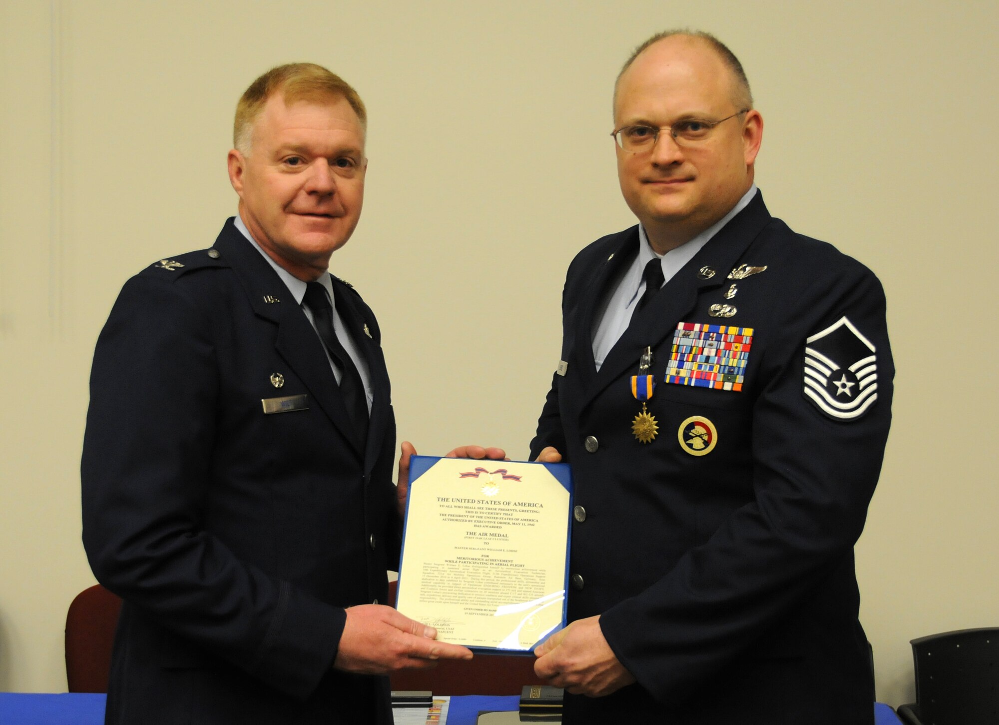 Col. Ronald A. Wilt, 934th Operations Group commander, presents the Air Medal to Master Sgt. William Louse of the 934th Aeromedical Evacuation Squadron at the Minneapolis-St. Paul Air Reserve Station, Minn.  (U.S. Air Force Photo/Tech. Sgt. Bob Sommer)