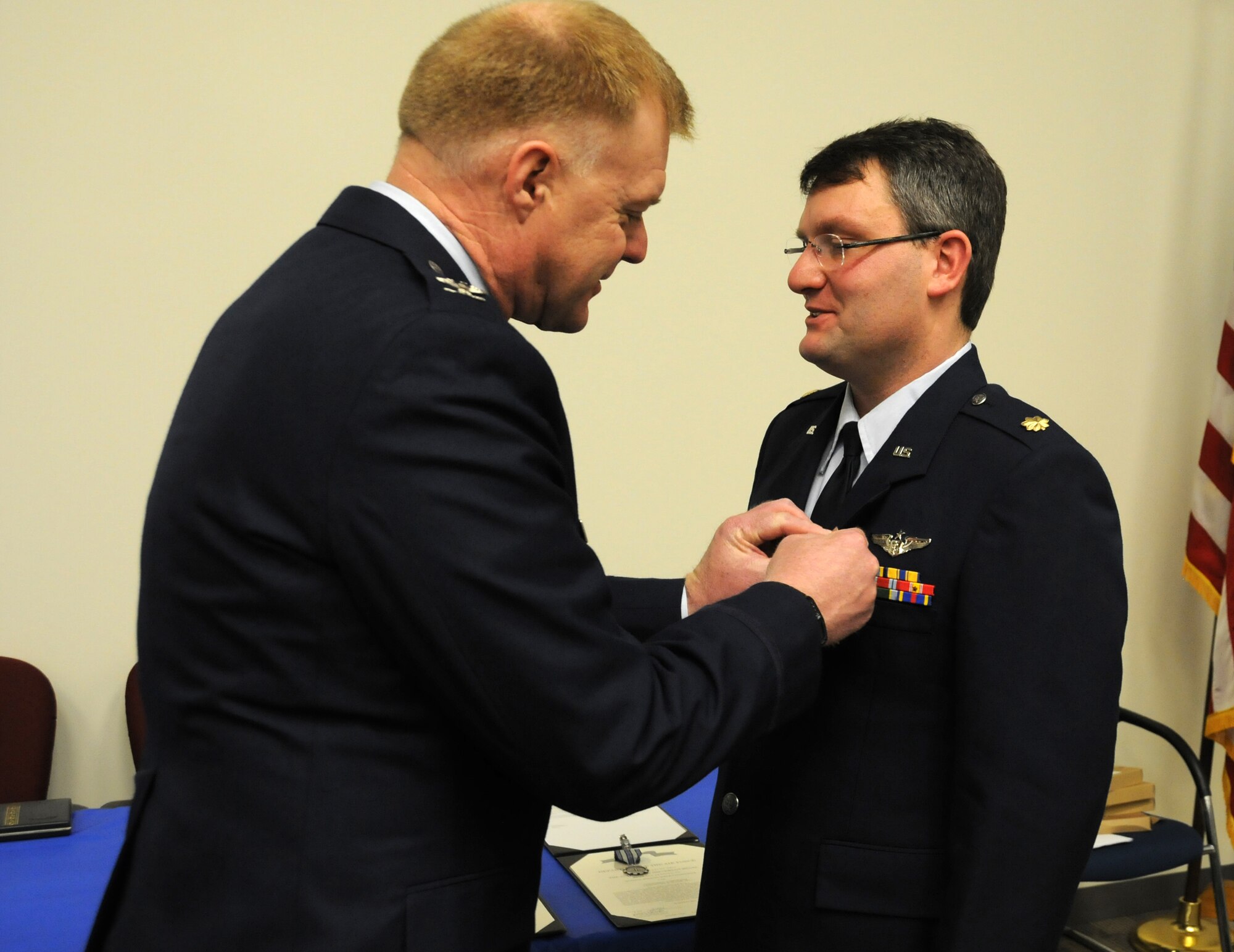 Col. Ronald A. Wilt, 934th Operations Group commander, presents the Air Medal to Maj. Bryan D. Koenig of the 934th Aeromedical Evacuation Squadron at the Minneapolis-St. Paul Air Reserve Station, Minn. (U.S. Air Force Photo/Tech. Sgt. Bob Sommer)