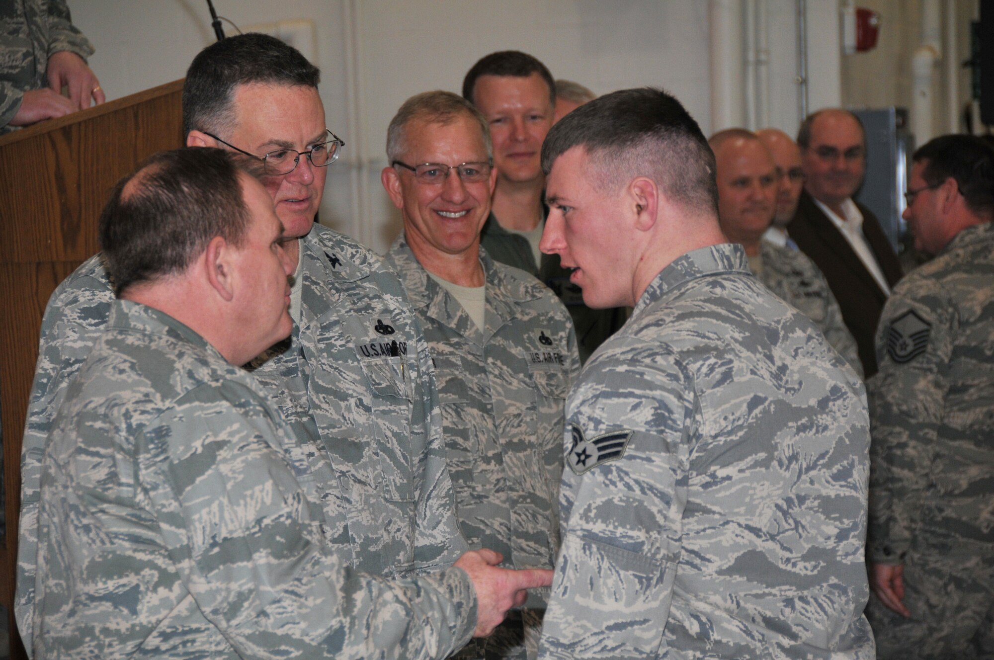 Col. Brian Miller, commander of the 185th Air Refueling Wing, welcomes home Senior Airman Darwin Kluender from his recent deployment during the 185th welcome home ceremony onMarch 3rd, 2012, in Sioux City, Iowa. During 2011, over 300 airmen from the 185th deployed to Iraq, Afghanistan, and numerous other locations around the globe in support of the Department of Defense contingency operations. (US Air Force Photo by TSgt Brian Cox)