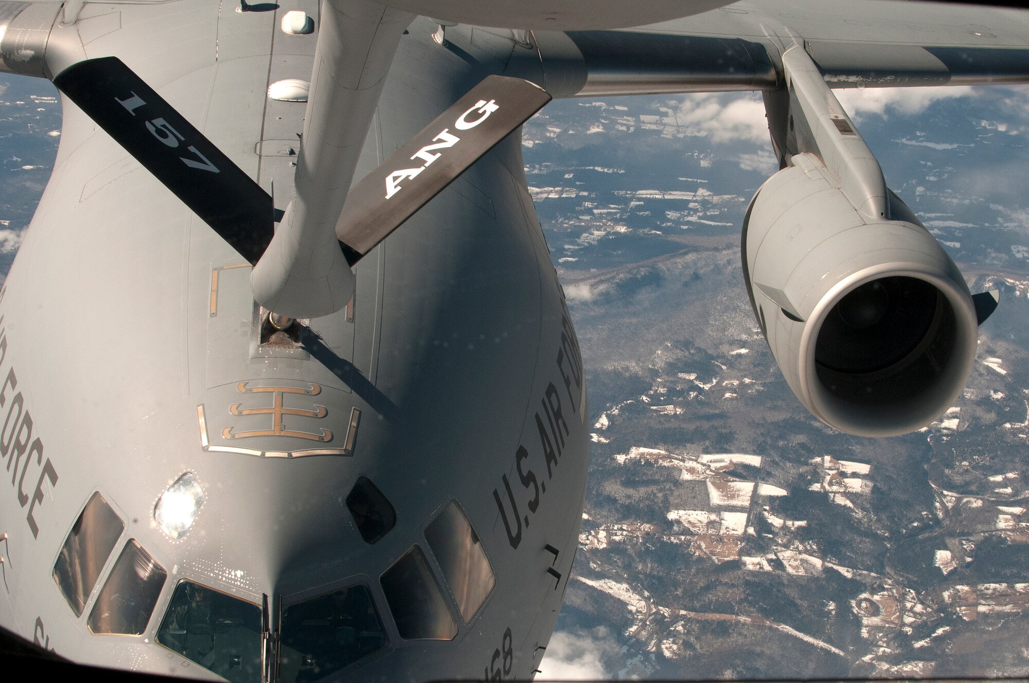 PEASE AIR NATIONAL GUARD BASE, N.H. -- The 157th Air Refueling Wing refuels a C-17 during a refueling mission Thursday high above N.H. with U.S. Sen. Kelly Ayotte on board.  Sen. Ayotte flew with the N.H. Air National Guard after posthumously presenting a medal decoration to a WWII Army National Guard member.  (National Guard photo by Tech. Sgt. Mark Wyatt/RELEASED)