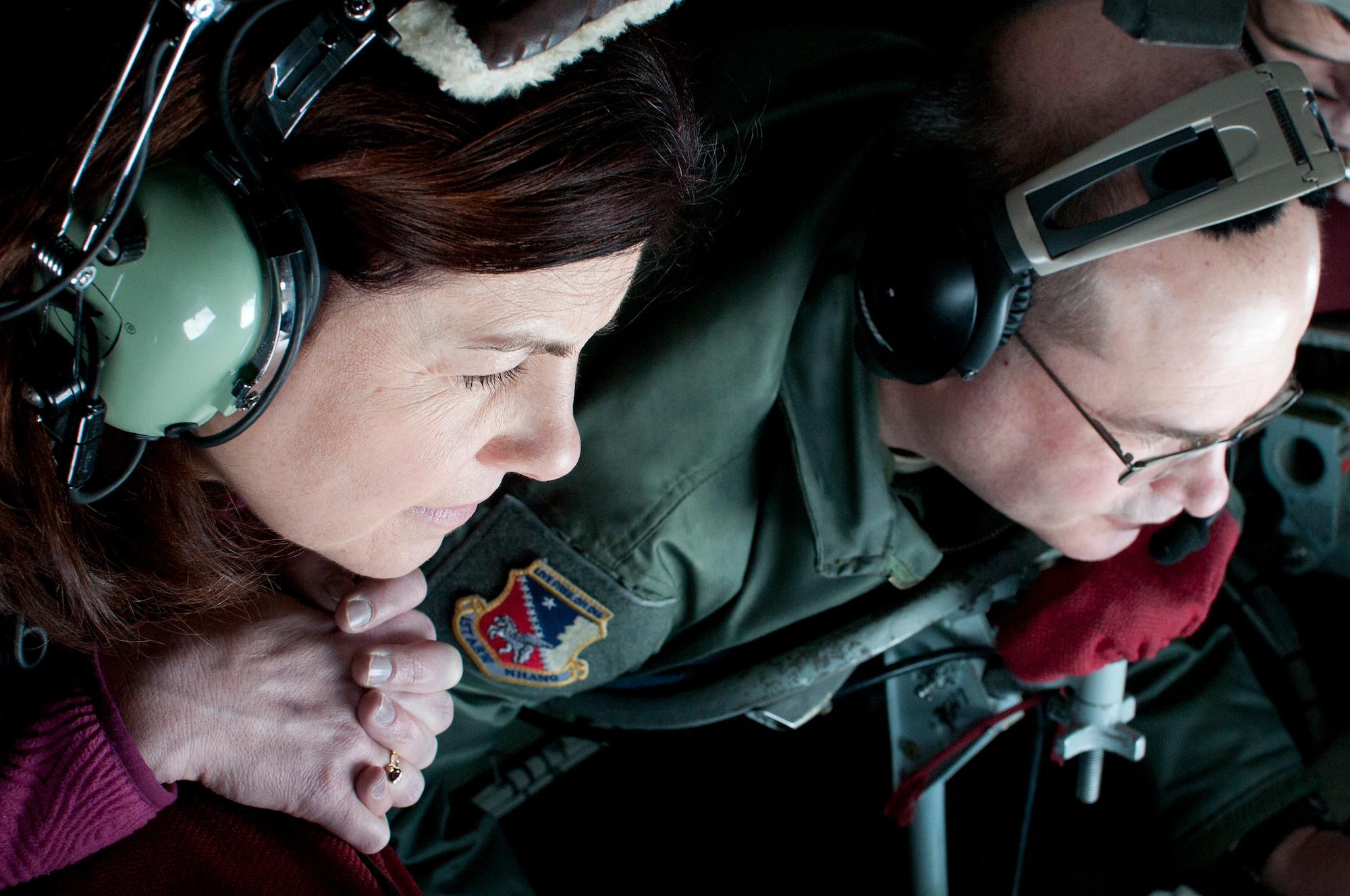 PEASE AIR NATIONAL GUARD BASE, N.H. -- U.S. Sen. Kelly Ayotte watches Master Sgt. Gary Howard, 133rd Air Refueling Squadron, refuel a C-17 high above N.H. Thursday during a refueling mission. Sen. Ayotte flew with the N.H. Air Na-tional Guard after posthumously presenting a medal decoration to a WWII Army National Guard member. (National Guard photo by Tech. Sgt. Mark Wyatt/RELEASED)