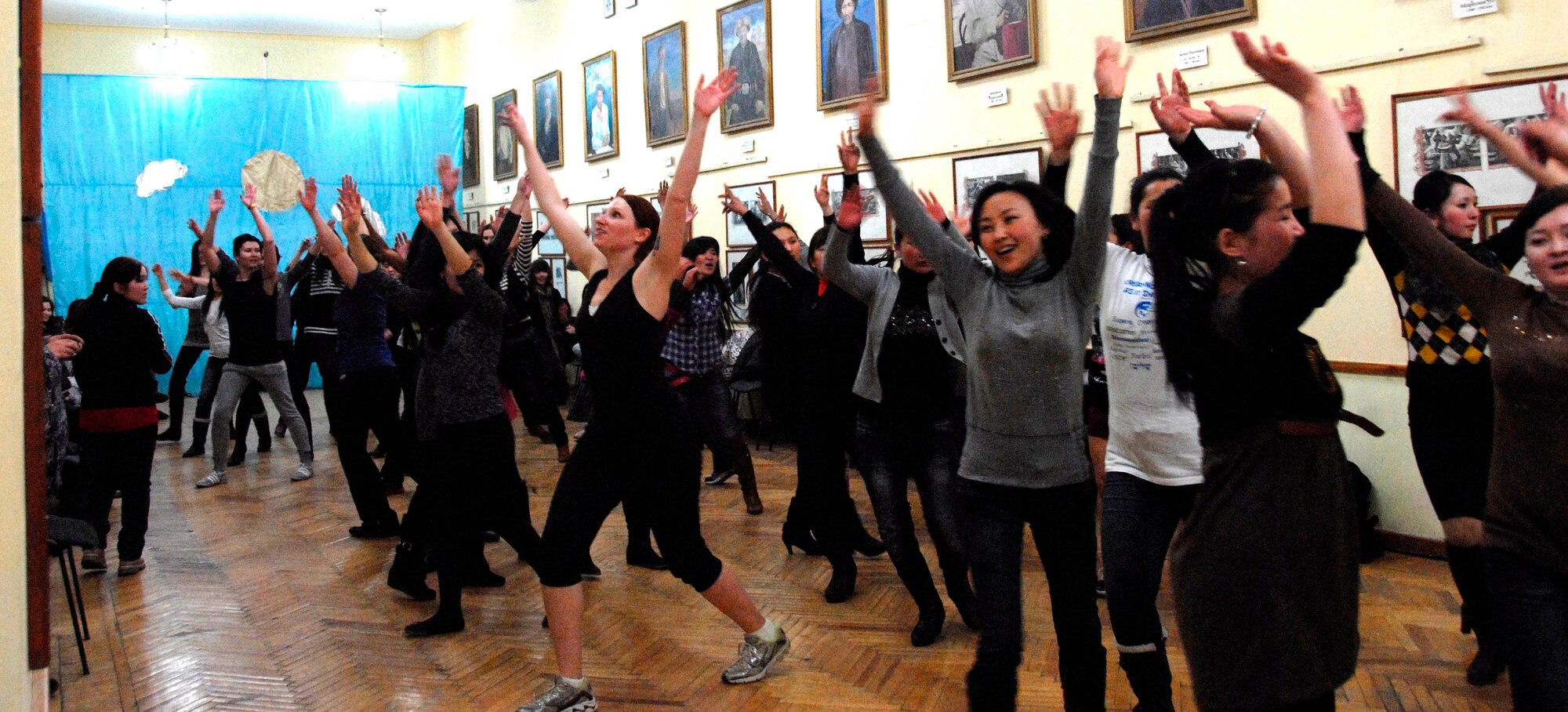 Kyrgyz and American women participate in a Zumba dance-a-thon at Bayalinov Children's Library in Bishkek, March 2, 2012. The group meets at the library to discuss a wide range of topics including this week's focus of fitness and exercise. (U.S. Air Force photo/Senior Airman Lynsie Nichols)
