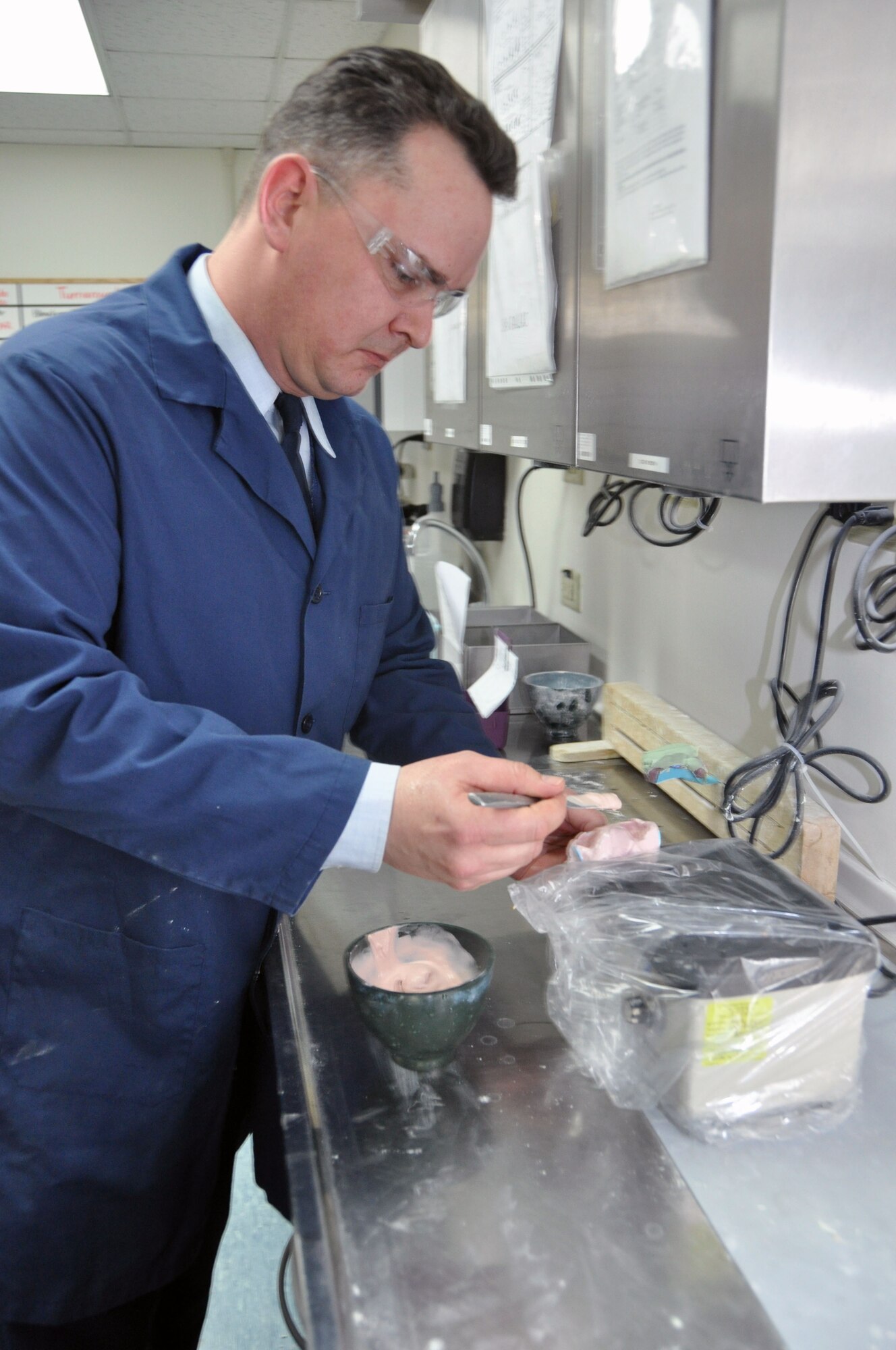 Staff Sgt. John Riaubia, 51st Dental Squadron Dental Lab alternate flight chief, prepares an impression of a  patient’s mouth to form a dental stone at the Osan Air Base Dental Lab Feb, 27, 2012. Technicians also have several advanced courses offered to them where they learn how to create prosthetics not associated with the mouth such as eyes, ears, noses and full skulls. (U.S. Air Force photo/Airman 1st Class Michael Battles)