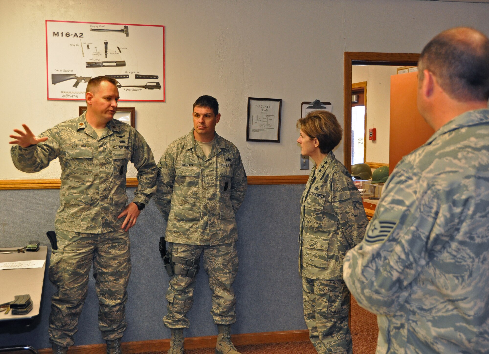 Major Kip M. Schlum, 944th Security Forces Squadron commander, briefs Lt. Gen. Judith A. Fedder, Deputy Chief of Staff for Logistics, Installations and Mission Support, Headquarters U.S. Air Force, Washington, D.C., during her visit with Airmen at Combat Arms Training and Maintenance training March 3.  Fedder was the guest speaker for the 56th Maintenance Professional of the Year Ceremony held at Luke Air Force Base March 3.  (U.S. Air Force photo by Staff Sgt. Denise Willhite)