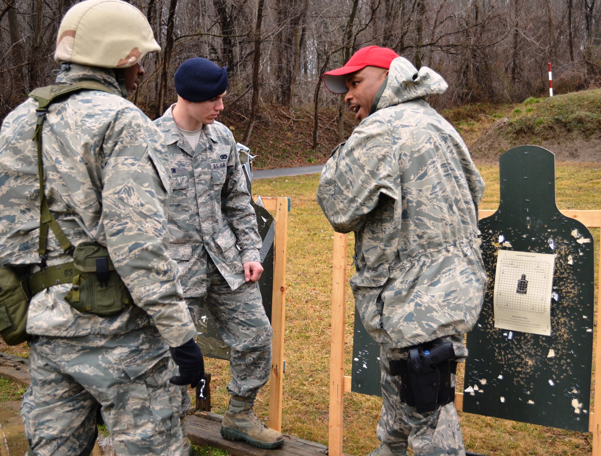 Airman First Class Daniel Generette, left, 135th Maintenance Squadron, listens to Tech. Sgt. Jerome Howard, right, a combat arms instructor, about his shooting on the rifle range at Gunpowder Military Reservation. The Maryland Air National Guard is in the process of changing the course of fire for small arms qualification which is mandated by the Air Force. (National Guard photo by Senior Airman Rebecca Salazar)