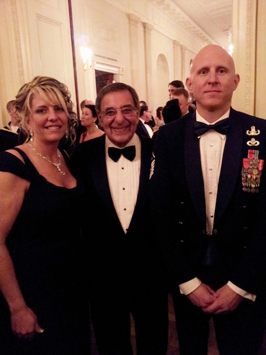 Master Sgt. Kevin Bullivant, 151st Civil Engineer Squadron, and his girlfriend Kathy Blanchard pose with the U.S. Secretary of Defense Leon Panetta at a White House dinner hosted by President and Mrs. Obama on Feb. 29, 2012. More than 70 service members who served in Operation Iraqi Freedom and/or Operation New Dawn and families were recognized at the event entitled, "A Nation's Gratitude Dinner.”  Bullivant was an explosive ordinance disposal specialist who received two Bronze Stars in Iraq, and was also submitted for a Purple Heart. Bullivant was one of two Air National Guard members recognized at the event.  (U.S. Air Force Courtesy Photo/Released)
