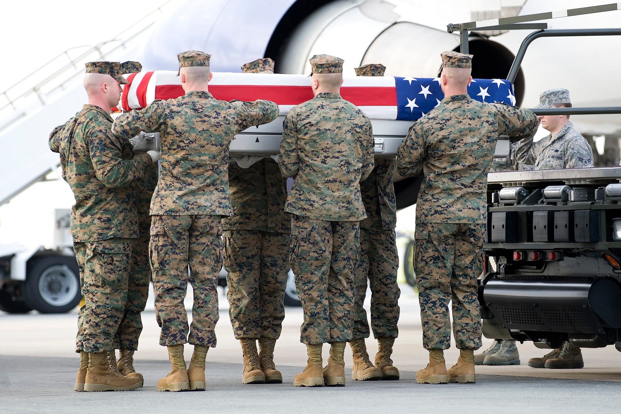 A U.S. Marine Corps carry team transfers the remains of Marine Cpl. Conner T. Lowry of Chicago, Ill., at Dover Air Force Base, Del., March 3, 2012. Lowry was assigned to the 2nd Battalion, 11th Marine Regiment, 1st Marine Division, I Marine Expeditionary Force, Camp Pendleton, Calif. (U.S. Air Force photo/Adrian R. Rowan)
