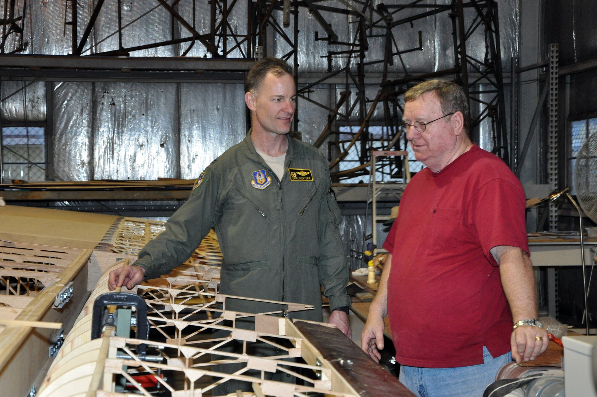 Frank McKinley (right) shows Brig. Gen. (then Col.) Eric Overturf, 442nd Fighter Wing Commander, the progress on a wing of a CG-4A glider at Whiteman Air Force Base, Mo., Feb. 28. The glider is being restored by volunteers.The 442nd Fighter Wing is an A-10 Thunderbolt II Air Force Reserve unit at Whiteman. (U.S. Air Force photo/Senior Airman Wesley Wright) 
 
