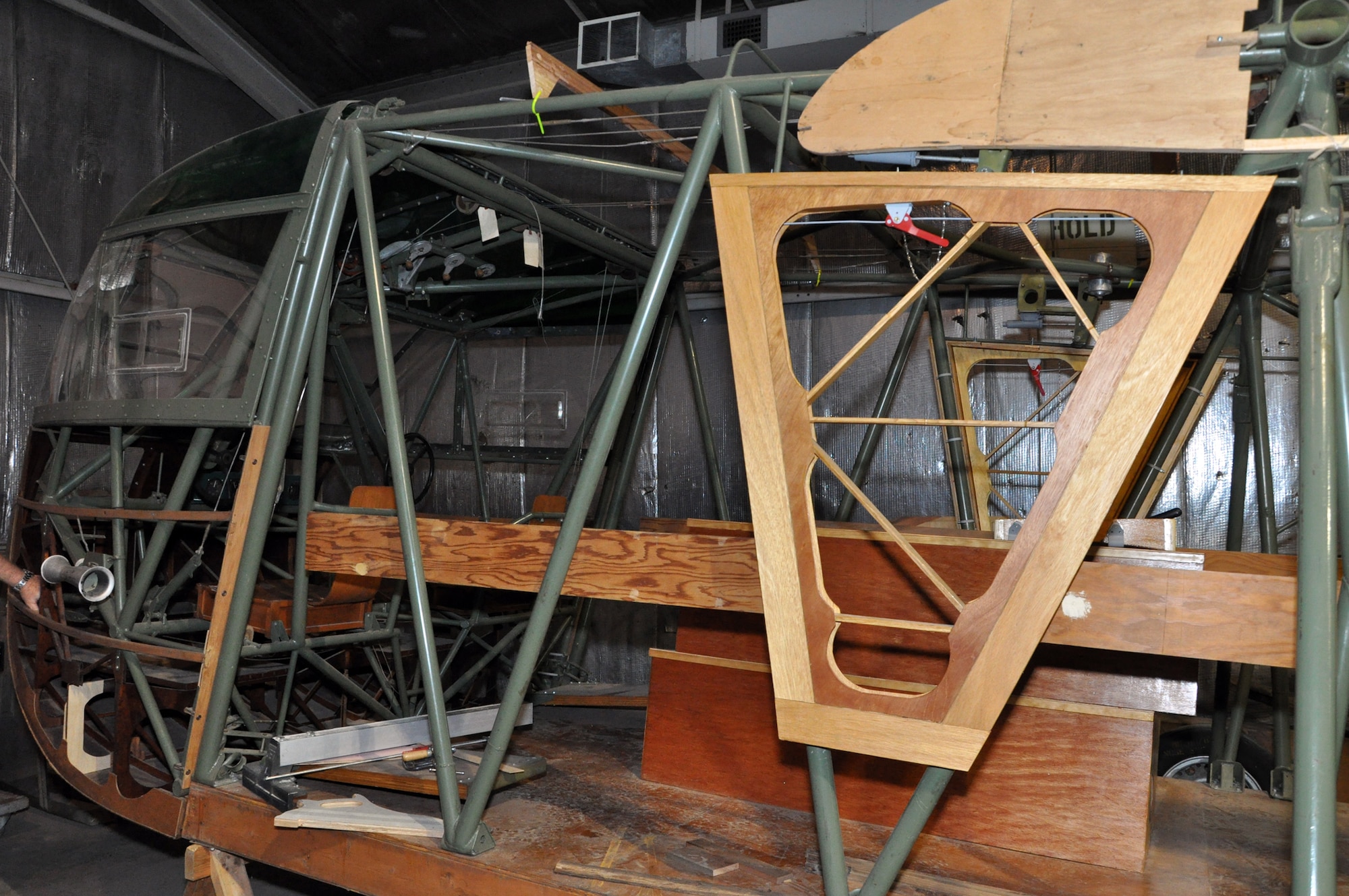 Progress made on the front section of a CG-4A glider being restored by volunteers at Whiteman Air Force Base, Mo., Feb. 28. The 442nd Fighter Wing is an A-10 Thunderbolt II Air Force Reserve unit at Whiteman. (U.S. Air Force photo/Senior Airman Wesley Wright)